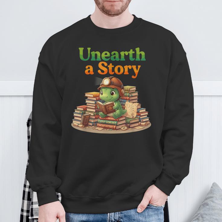 Unearth a Story Summer 2026 Dinosaur Reading Books Dino Sweatshirt Gifts for Old Men Unearth a Story Summer 2026 Dinosaur Reading Books Dino Sweatshirt Gifts for Old Men