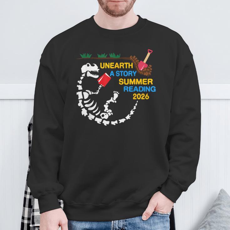 Unearth a Story T-Rex Reading a Book Summer Reading 2026 Sweatshirt Gifts for Old Men Unearth a Story T-Rex Reading a Book Summer Reading 2026 Sweatshirt Gifts for Old Men