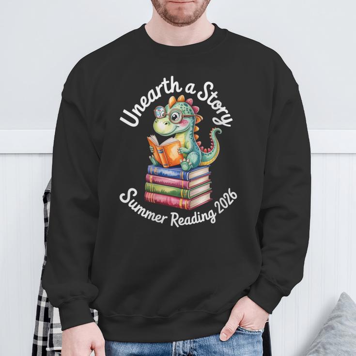 Women's Unearth a Story Summer Reading 2026 Book Lover Dino Fun Sweatshirt Gifts for Old Men Women's Unearth a Story Summer Reading 2026 Book Lover Dino Fun Sweatshirt Gifts for Old Men