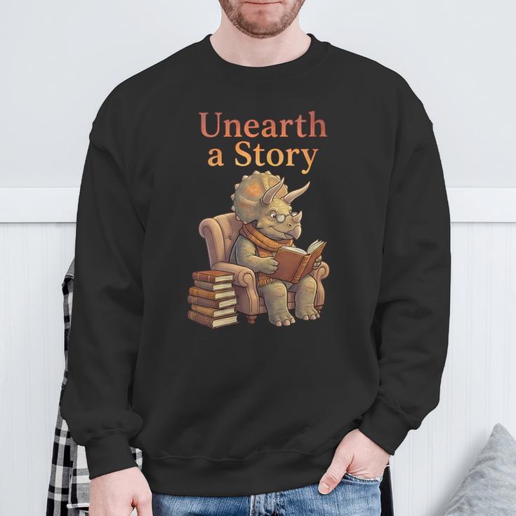 Women's Unearth a Story Triceratops Dinosaur Reading Books Dino Sweatshirt Gifts for Old Men