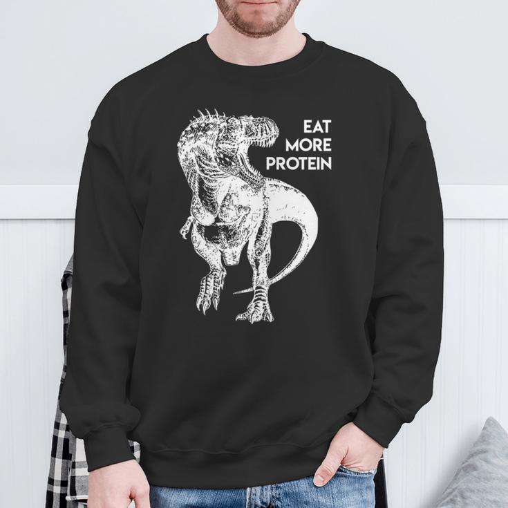 ハングリー・ダイナソー 肉食 肉食恐竜 Tレックスもっとタンパク質を食べる 高タンパク食 フィットネス 長袖tシャツ スウェットシャツ 高齢者への贈り物