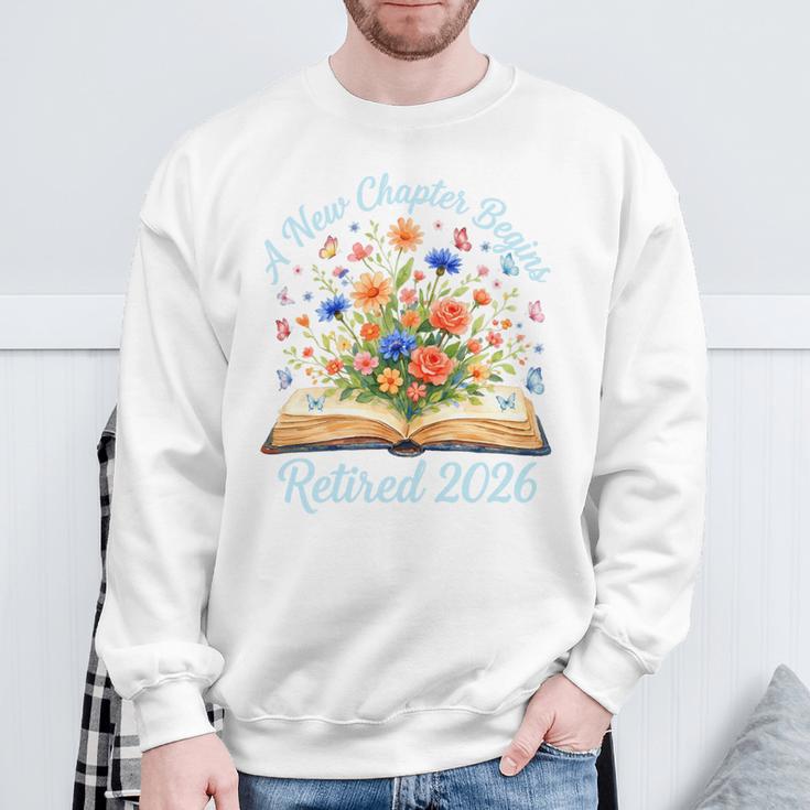 New Chapter Begins Retired 2026 Watercolor Floral Book Women Premium Tri-Blend Sweatshirt Gifts for Old Men