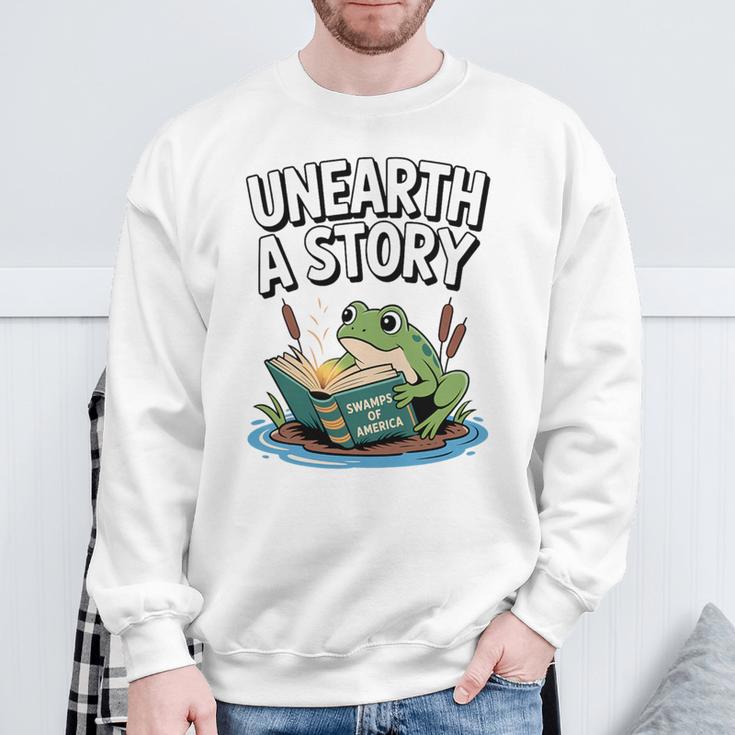 Unearth a Story Frog Reading a Book Summer 2026 Premium Tri-Blend Sweatshirt Gifts for Old Men