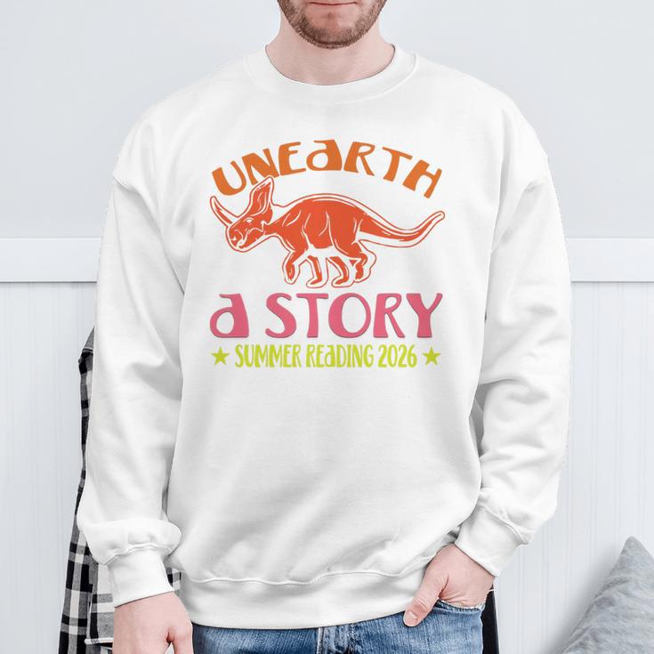 Unearth a Story Summer Reading 2026 Triceratops Dino Book Premium Tri-Blend Sweatshirt Gifts for Old Men