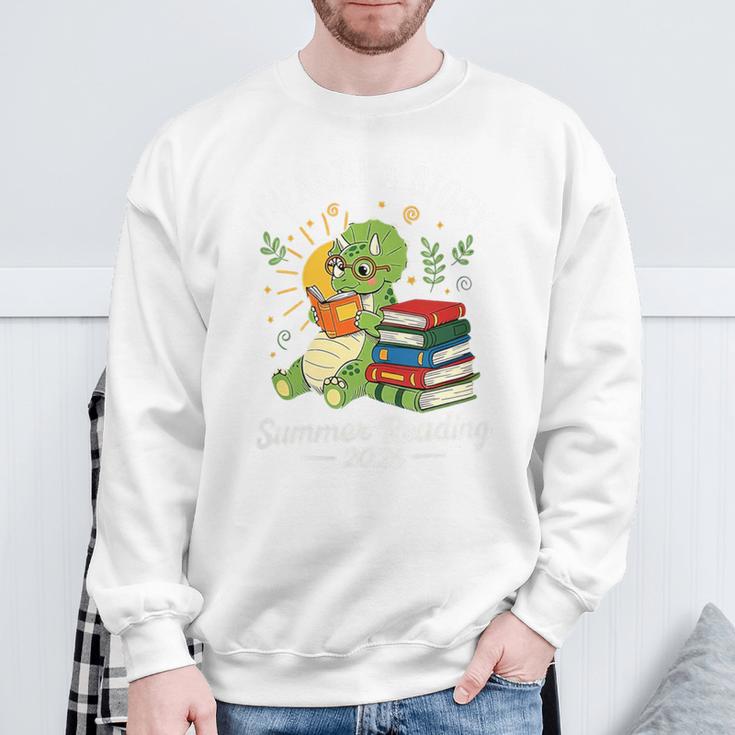 Unearth a Story Triceratops Dinosaur Reading Books Cute Dino Premium Tri-Blend Sweatshirt Gifts for Old Men