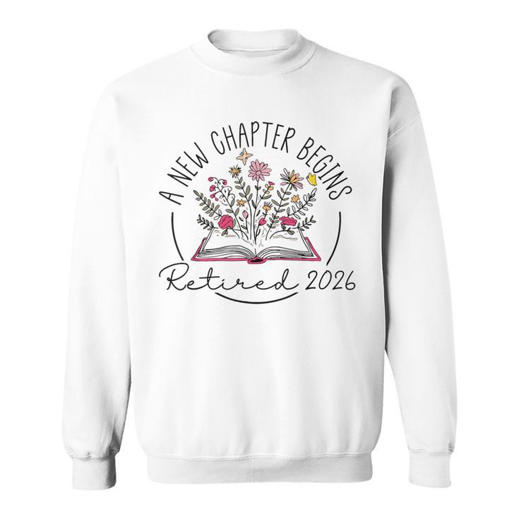 A New Chapter Retired 2026 Begins Retirement Wildflower Book Sweatshirt