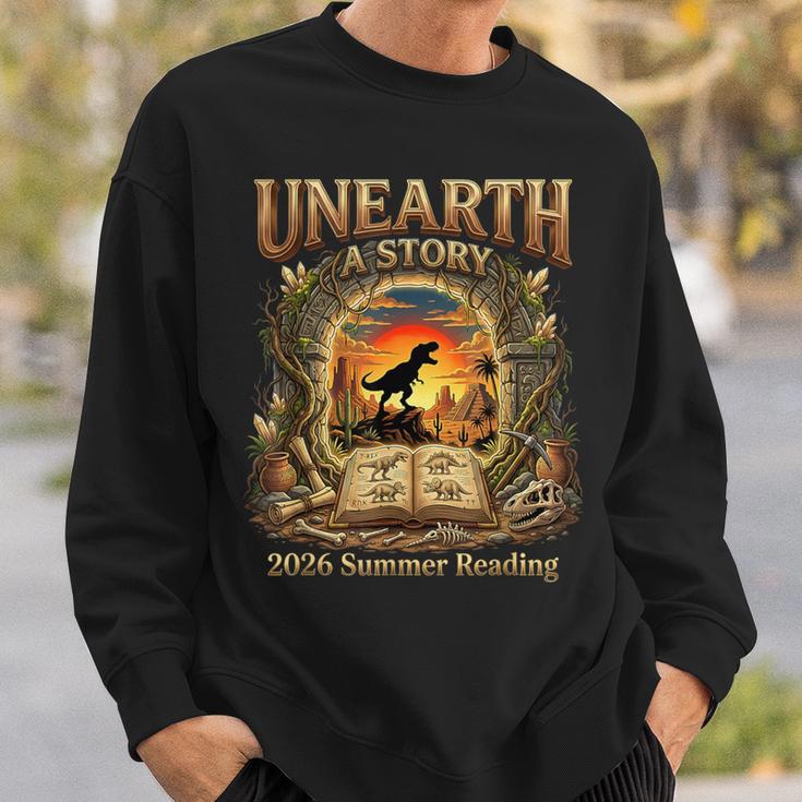 2026 Summer Reading Dinosaur Unearth A Story Book Lover Sweatshirt Gifts for Him 2026 Summer Reading Dinosaur Unearth A Story Book Lover Sweatshirt Gifts for Him