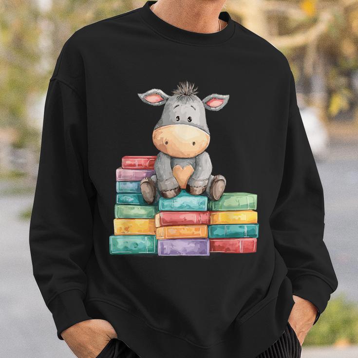 Adorable Donkey With Heart Sitting On Colorful Book Stack Sweatshirt Gifts for Him