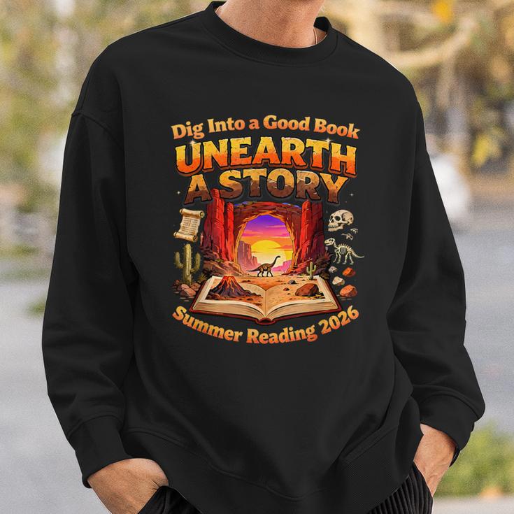 Books Summer Reading 2026 Unearth A Story Dinosaur Sweatshirt Gifts for Him