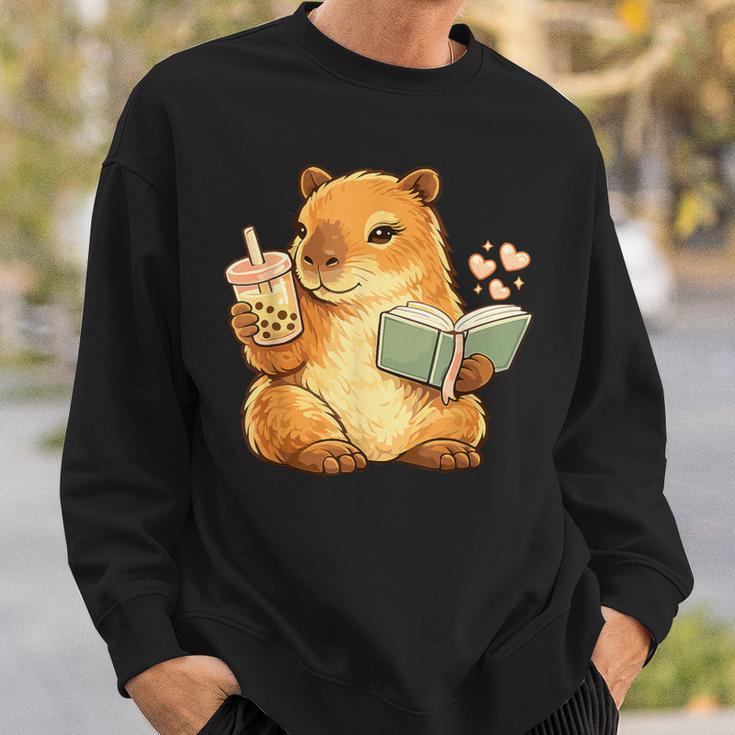 Capybara Reading a Book With Bubble Tea Sweatshirt Gifts for Him