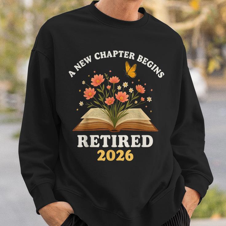 A New Chapter Begins Retired 2026 Floral Book Butterfly Tee Sweatshirt Gifts for Him