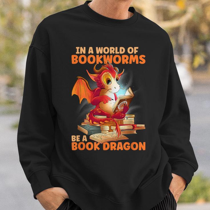 Read Be A Book Dragon Bookworm Sweatshirt Gifts for Him