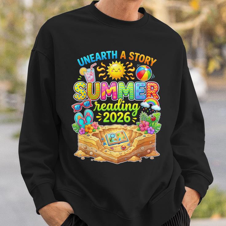 Summer Reading 2026 Unearth a Story Book Reading Sweatshirt Gifts for Him Summer Reading 2026 Unearth a Story Book Reading Sweatshirt Gifts for Him