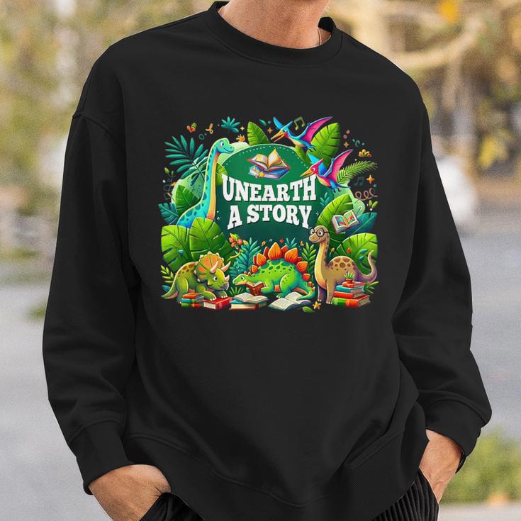 Unearth a Story Library Summer Reading 2026 Dinosaur Book Sweatshirt Gifts for Him Unearth a Story Library Summer Reading 2026 Dinosaur Book Sweatshirt Gifts for Him