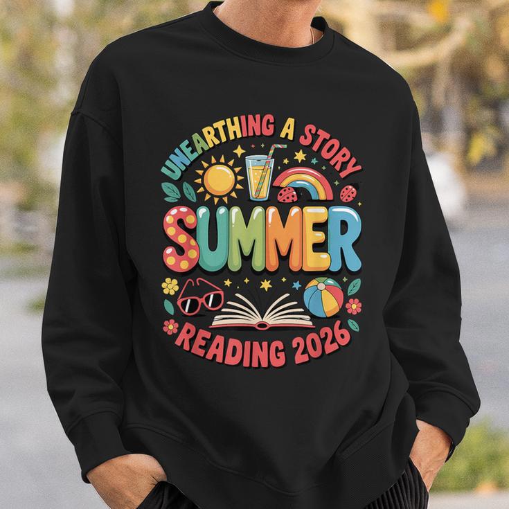 Unearth a Story Summer 2026 Summer Reading Program Book Sweatshirt Gifts for Him Unearth a Story Summer 2026 Summer Reading Program Book Sweatshirt Gifts for Him