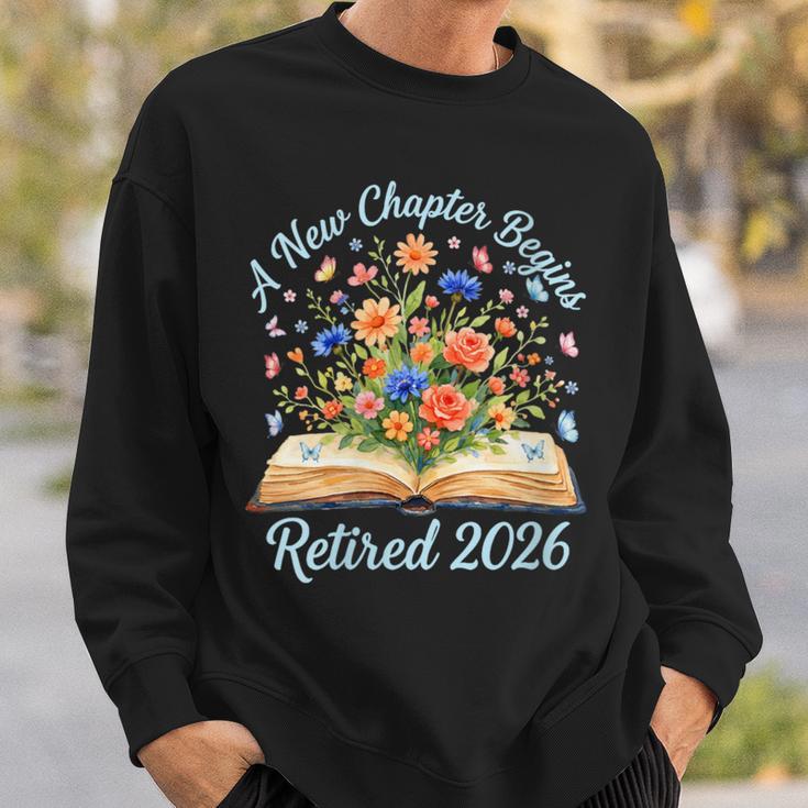 Women's New Chapter Begins Retired 2026 Watercolor Floral Book Women Sweatshirt Gifts for Him