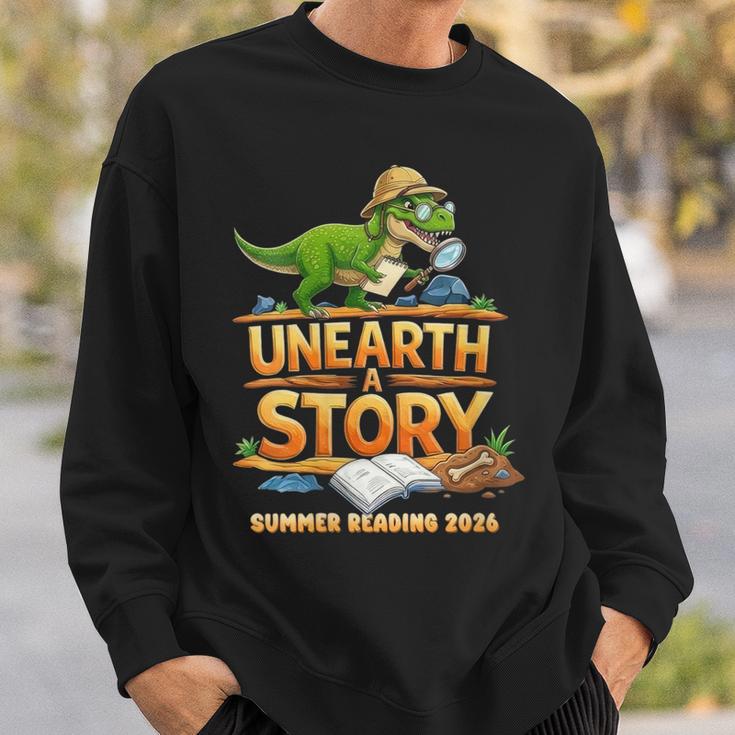 Women's Unearth a Story Dinosaur Reading Books Summer 2026 Sweatshirt Gifts for Him
