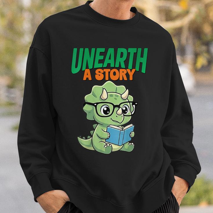 Women's Unearth a Story Summer Reading 2026 Triceratops Dino Book Sweatshirt Gifts for Him