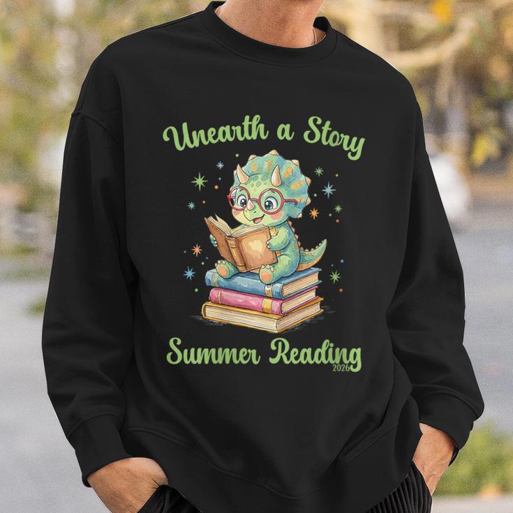 Women's Unearth a Story Triceratops Dinosaur Reading Books Cute Dino Sweatshirt Gifts for Him