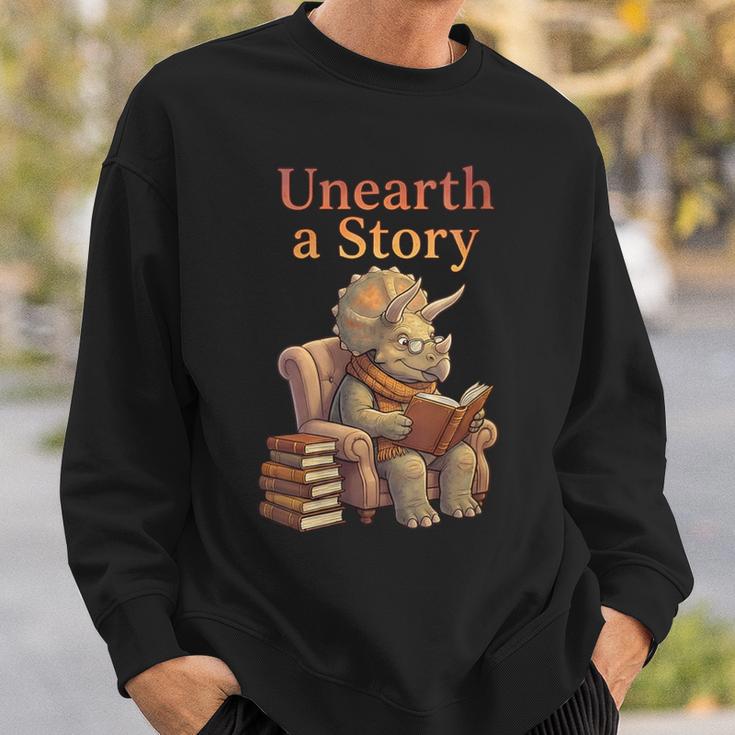 Women's Unearth a Story Triceratops Dinosaur Reading Books Dino Sweatshirt Gifts for Him