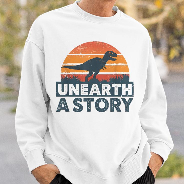 Unearth A Story Dinosaur Reader Book Lover 2026 Sweatshirt Gifts for Him