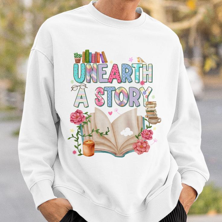 Unearth A Story Library Book Reading Program 2026 Summer Sweatshirt Gifts for Him Unearth A Story Library Book Reading Program 2026 Summer Sweatshirt Gifts for Him