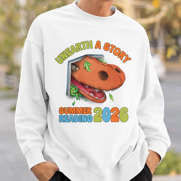 Unearth A Story Summer Reading 2026 Dinosaur Book Lover Dino Premium Tri-Blend Sweatshirt Gifts for Him