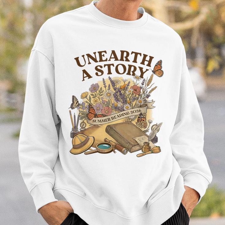 Unearth A Story Summer Reading 2026 Flower Butterfly Book Sweatshirt Gifts for Him Unearth A Story Summer Reading 2026 Flower Butterfly Book Sweatshirt Gifts for Him