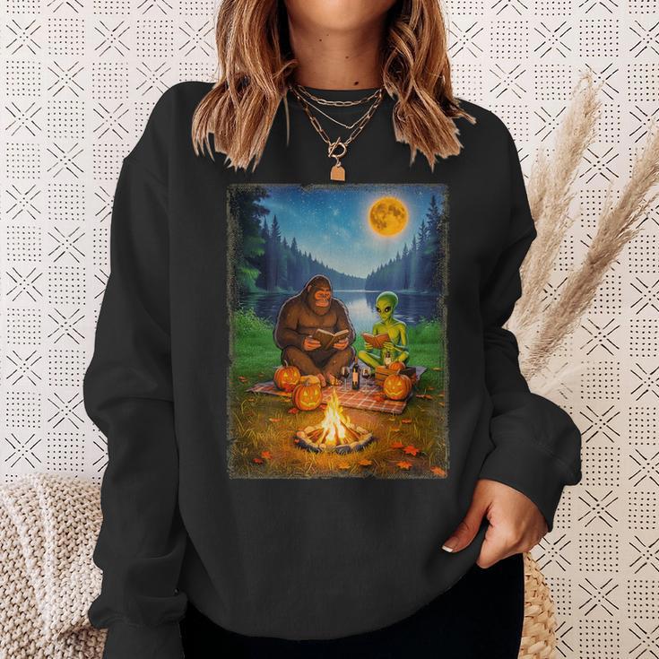 Bigfoot And Alien Reading Books Campfire Halloween Sweatshirt Gifts for Her