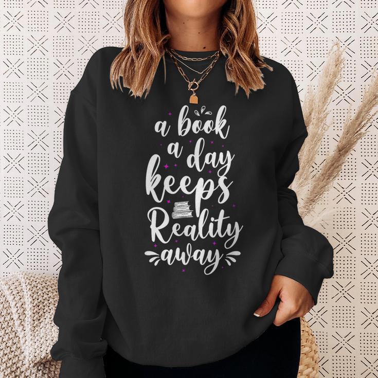 Book Reading A Book A Day Keeps Reality Away Sweatshirt Gifts for Her