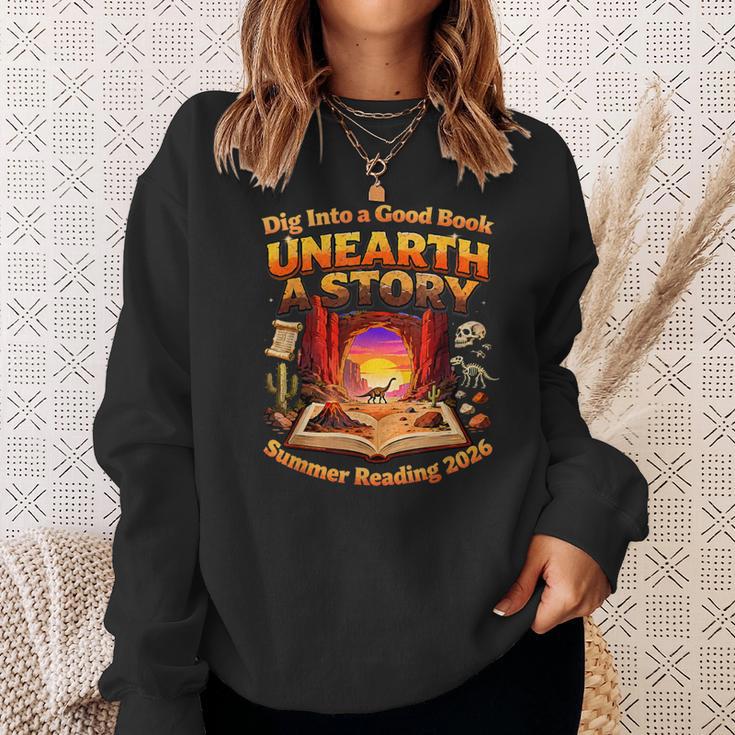 Books Summer Reading 2026 Unearth A Story Dinosaur Sweatshirt Gifts for Her