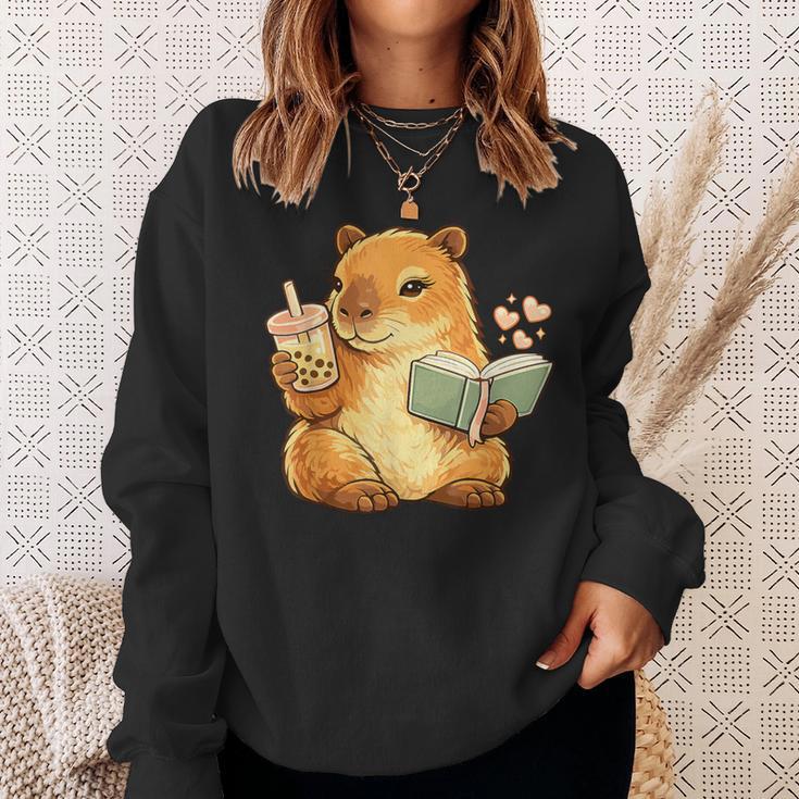 Capybara Reading a Book With Bubble Tea Sweatshirt Gifts for Her