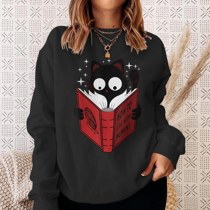 Cat Reads Book How To Live With Humans Sweatshirt Gifts for Her