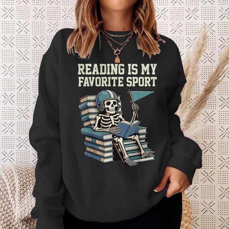 Football Skeleton Reading On Book Stack Sweatshirt Gifts for Her