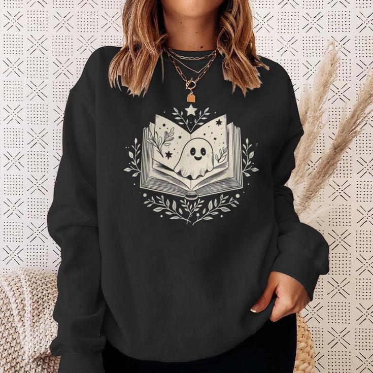 Haunted Library – Glowing Book Sweatshirt Gifts for Her Haunted Library – Glowing Book Sweatshirt Gifts for Her