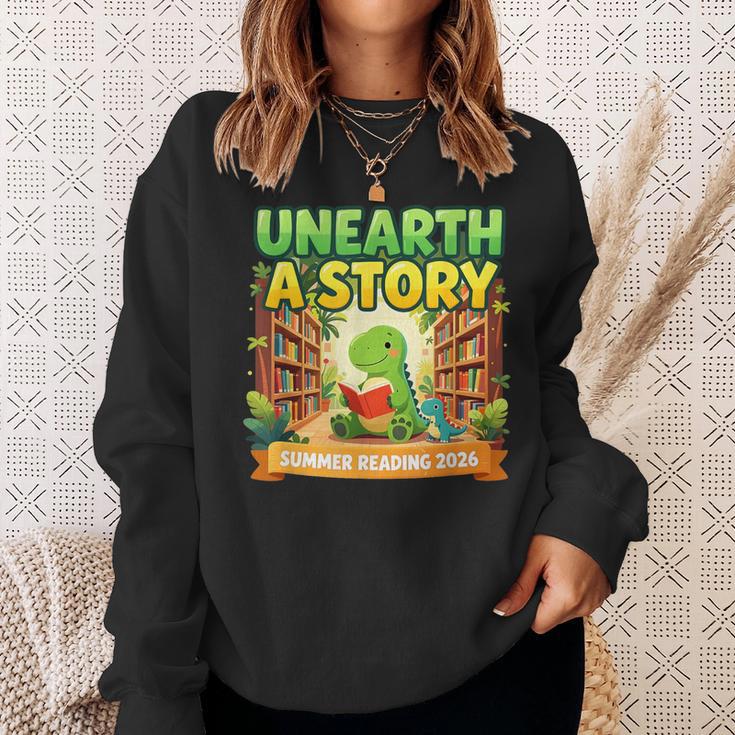 Unearth A Story Dinosaur Summer Reading 2026 Books Sweatshirt Gifts for Her