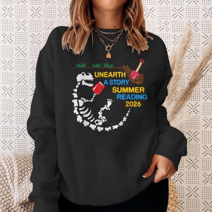 Unearth a Story T-Rex Reading a Book Summer Reading 2026 Sweatshirt Gifts for Her Unearth a Story T-Rex Reading a Book Summer Reading 2026 Sweatshirt Gifts for Her