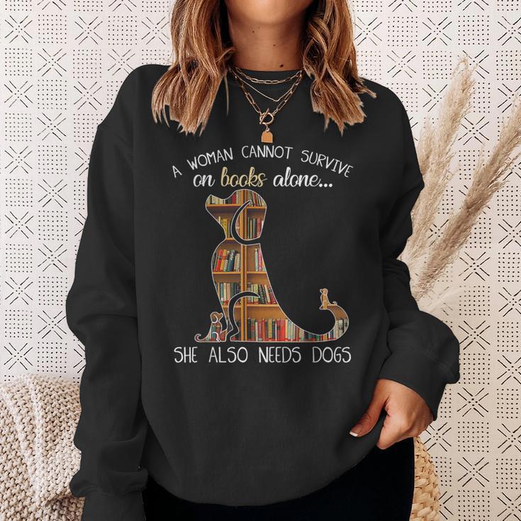 A Woman Cannot Survive On Books Alone She Also Needs Dogs Sweatshirt Gifts for Her A Woman Cannot Survive On Books Alone She Also Needs Dogs Sweatshirt Gifts for Her