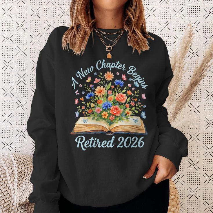 Women's New Chapter Begins Retired 2026 Watercolor Floral Book Women Sweatshirt Gifts for Her