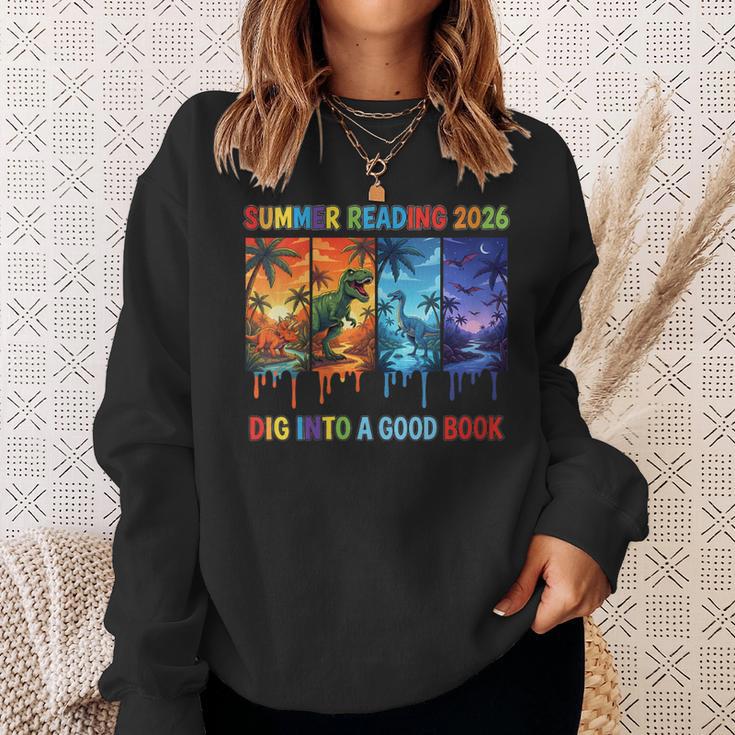 Women's Summer Reading 2026 Unearth A Story Dinosaur Books Sweatshirt Gifts for Her
