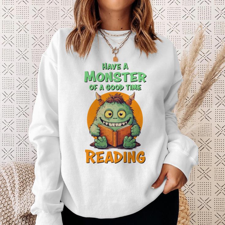 Halloween Teacher Librarian Monster Reading Books Performance Sweatshirt Gifts for Her Halloween Teacher Librarian Monster Reading Books Performance Sweatshirt Gifts for Her