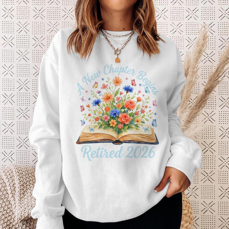 New Chapter Begins Retired 2026 Watercolor Floral Book Women Premium Tri-Blend Sweatshirt Gifts for Her