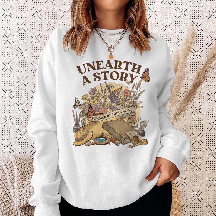 Unearth A Story Summer Reading 2026 Flower Butterfly Book Sweatshirt Gifts for Her Unearth A Story Summer Reading 2026 Flower Butterfly Book Sweatshirt Gifts for Her