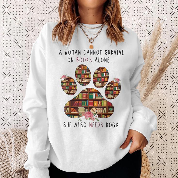 A Woman Cannot Survive On Books Alone She Also Needs Dog Sweatshirt Gifts for Her