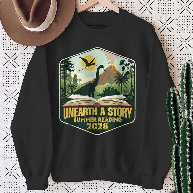 2026 Summer Reading Unearth a Story Teachers Students Book Sweatshirt Gifts for Old Women 2026 Summer Reading Unearth a Story Teachers Students Book Sweatshirt Gifts for Old Women