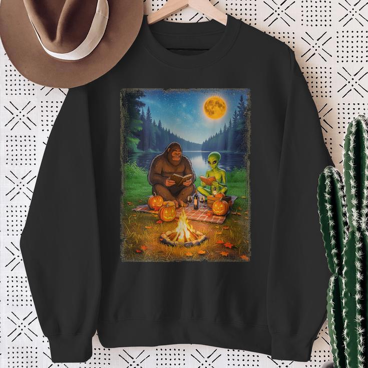 Bigfoot And Alien Reading Books Campfire Halloween Sweatshirt Gifts for Old Women