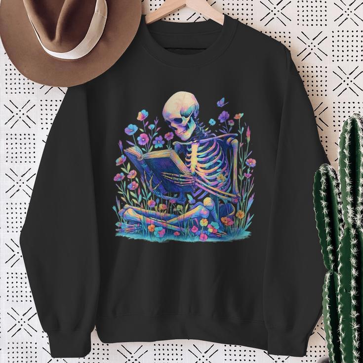 Bookish Skeleton Reading In Wildflowers Book Lover Bookworm Sweatshirt Gifts for Old Women