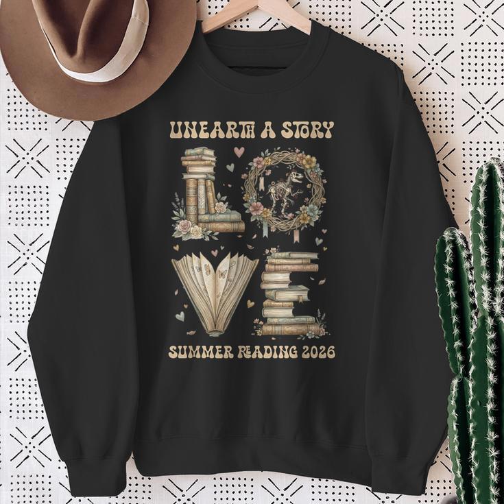 Love Unearth a Story Summer Reading 2026 Dino Skeleton Book Sweatshirt Gifts for Old Women
