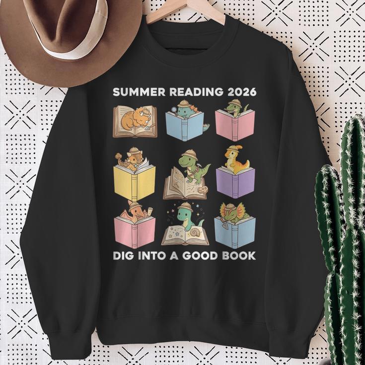 Summer Reading 2026 Unearth A Story Dinosaur Books Readers Sweatshirt Gifts for Old Women
