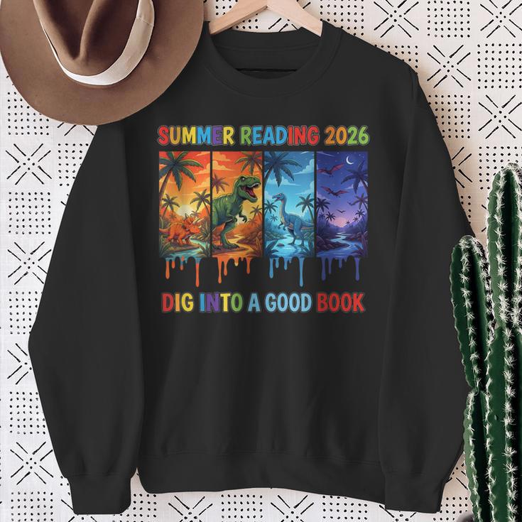 Summer Reading 2026 Unearth A Story Dinosaur Books Sweatshirt Gifts for Old Women
